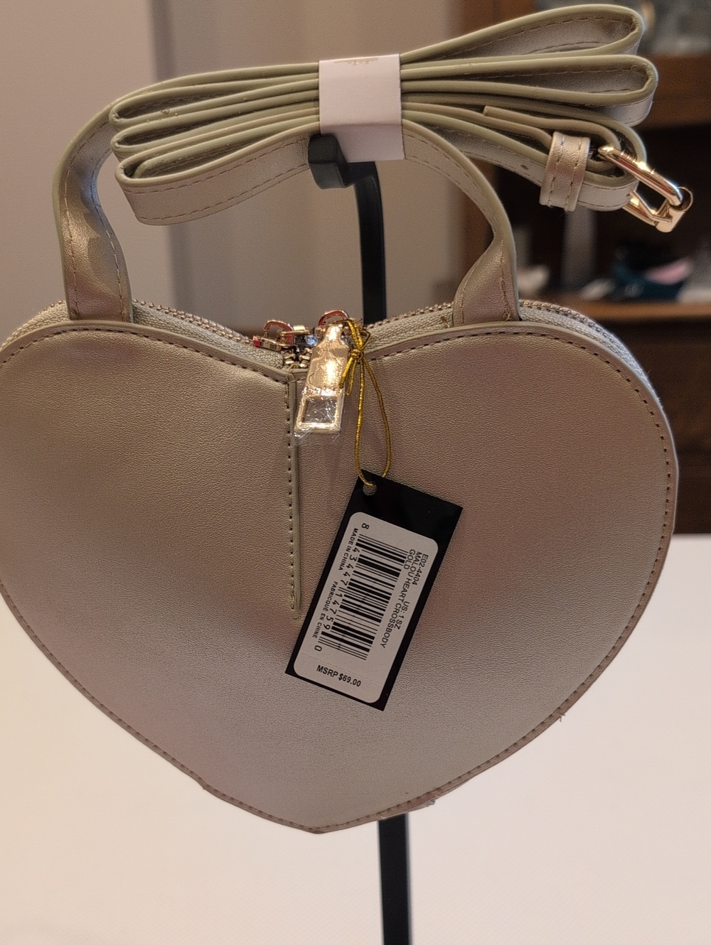 Bebe Heart-Shaped Crossbody Bag in Gold